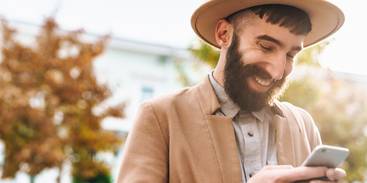 A man watching and engaging with an interactive live stream on his mobile phone