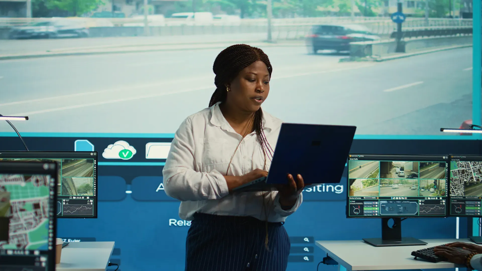 A lady working on a laptop in an office settings
