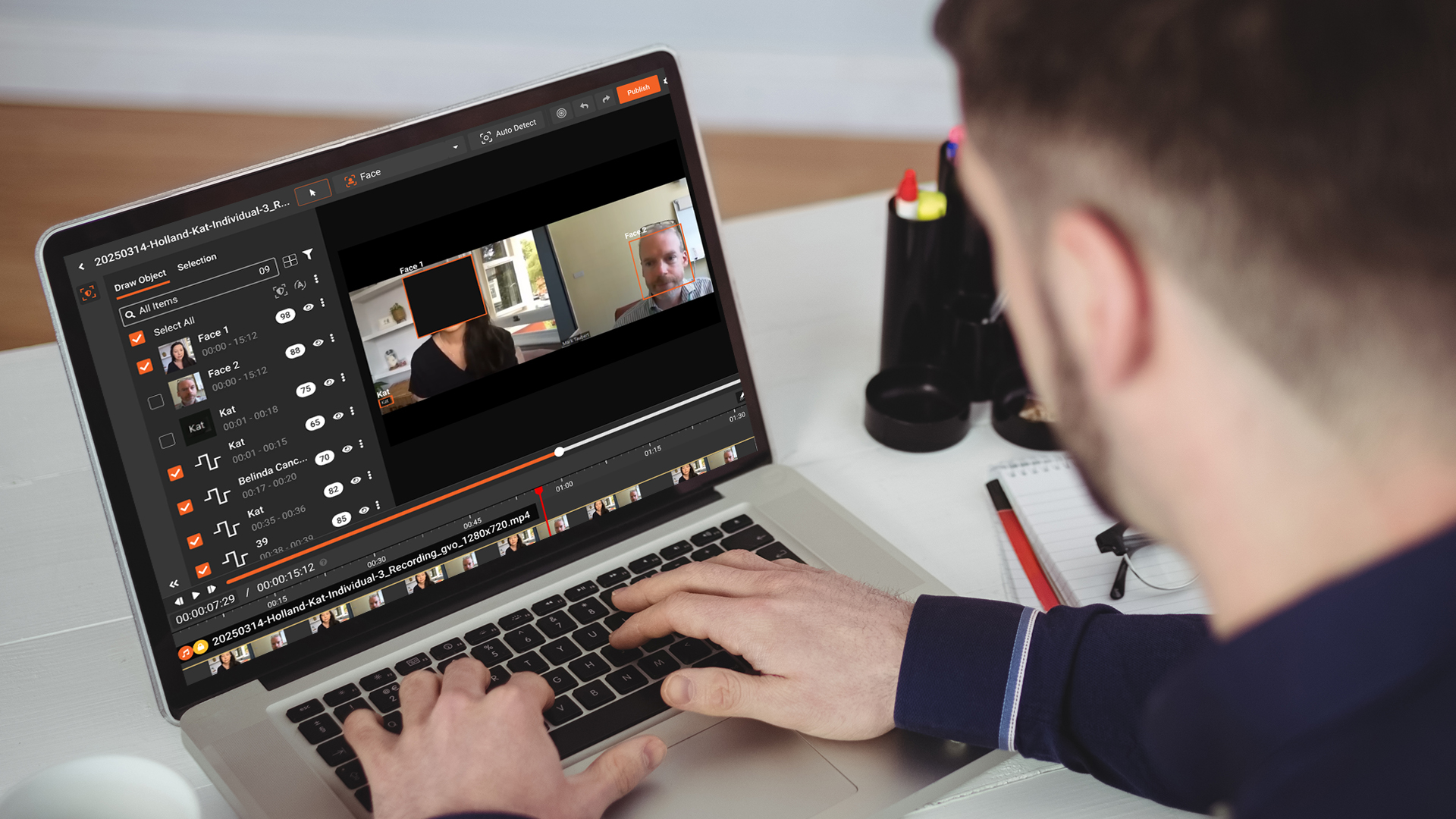 a person redacting multiple faces using ai redaction
