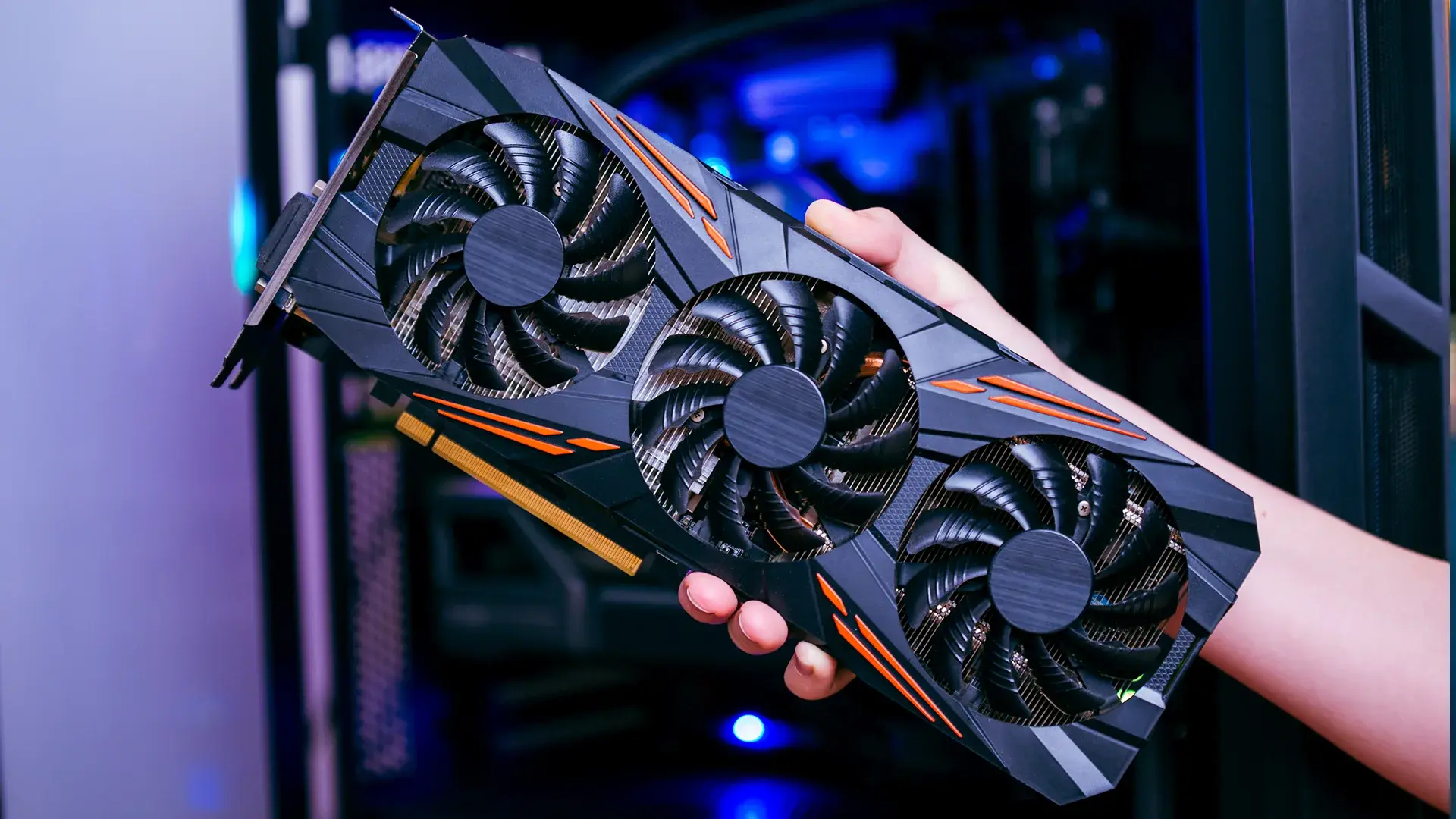 A person holding GPU in Hand