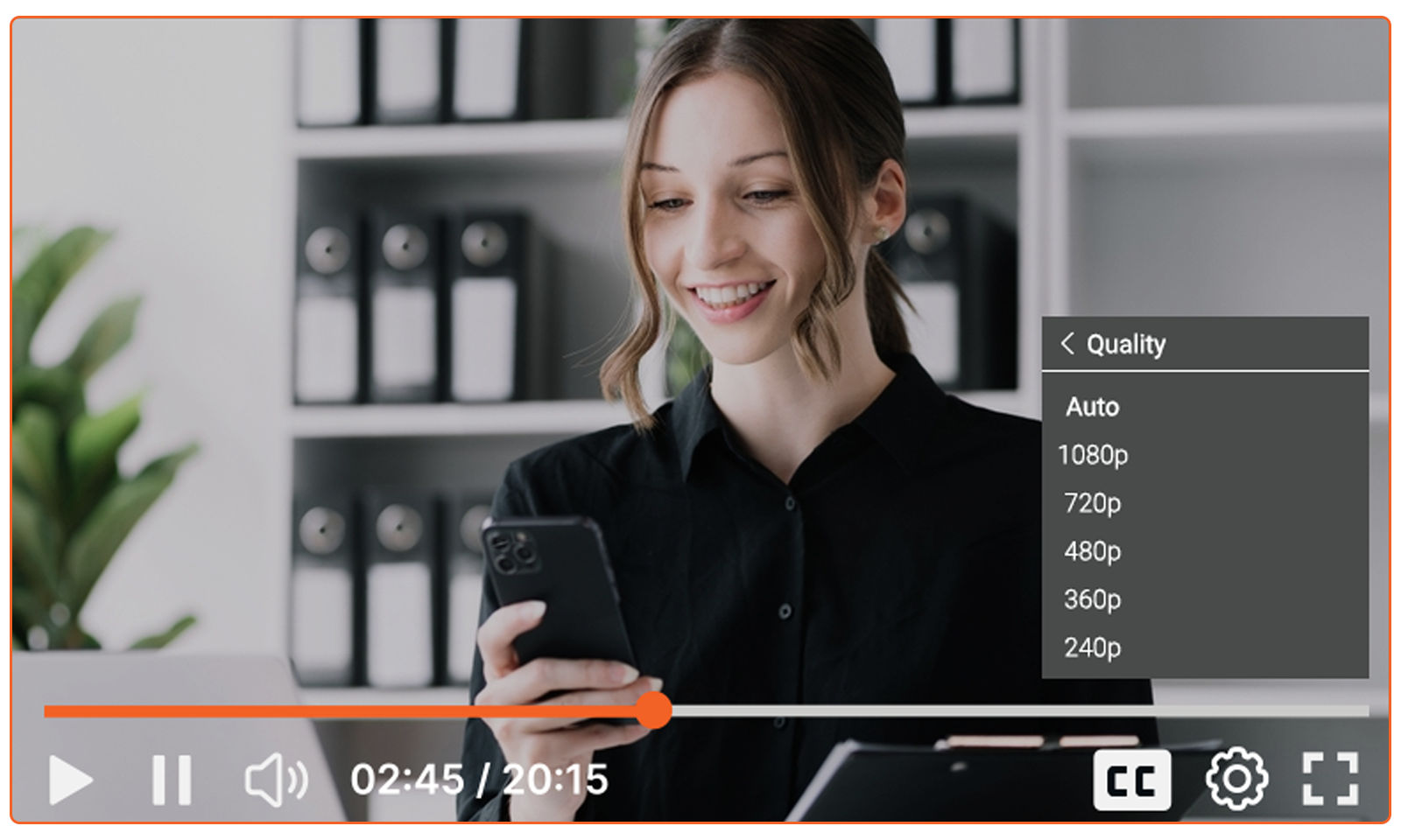 A woman smiling while enjoying video streaming on her phone.