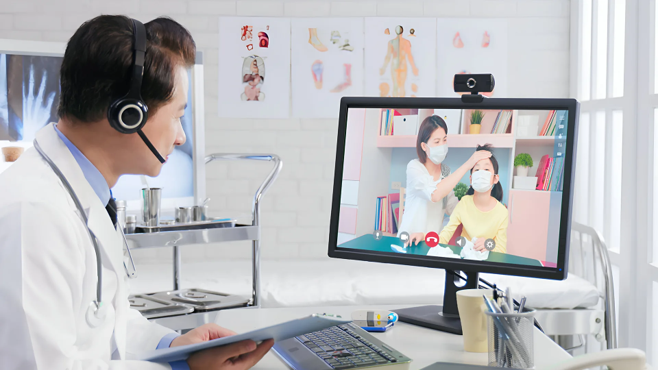 A doctor watching a clinic video