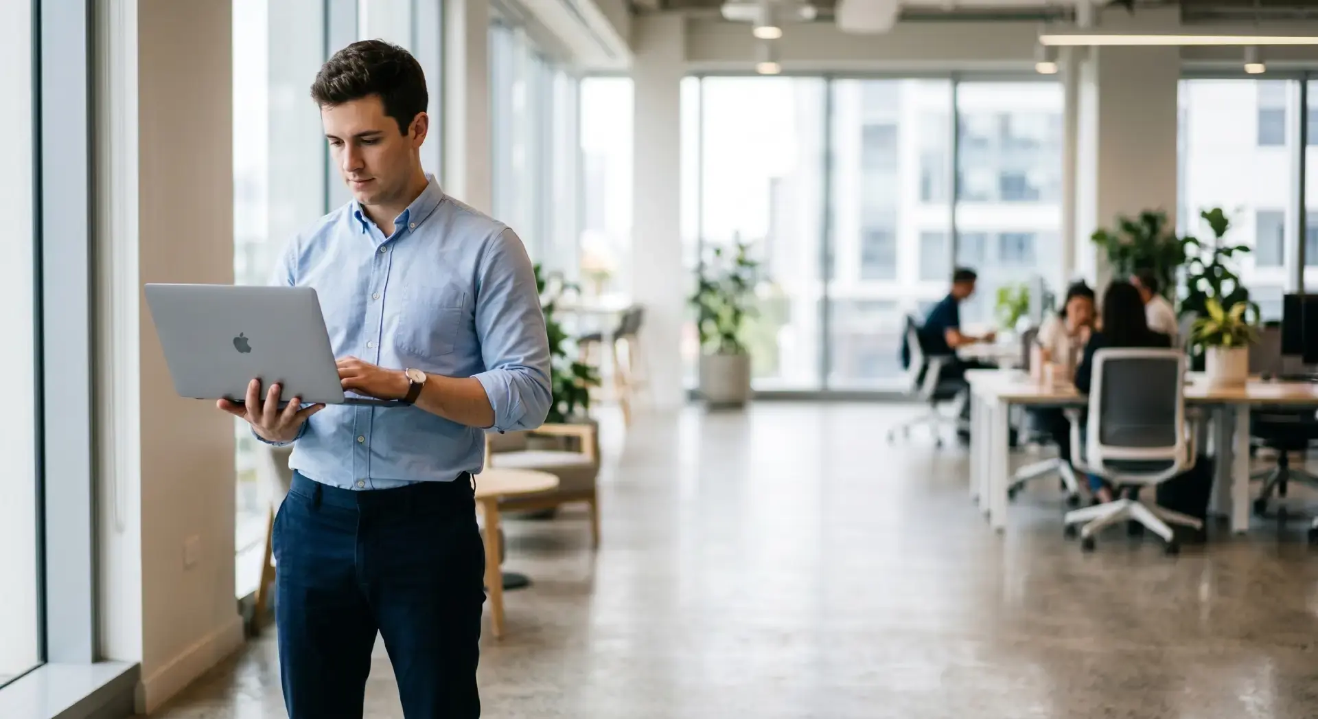 a person using a laptop in an office settings