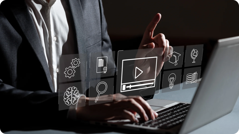A person using a laptop for video content management and intelligence.