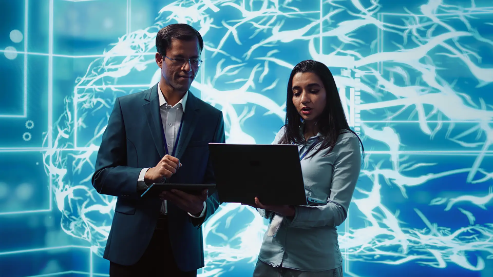 A lady presenting on a laptop