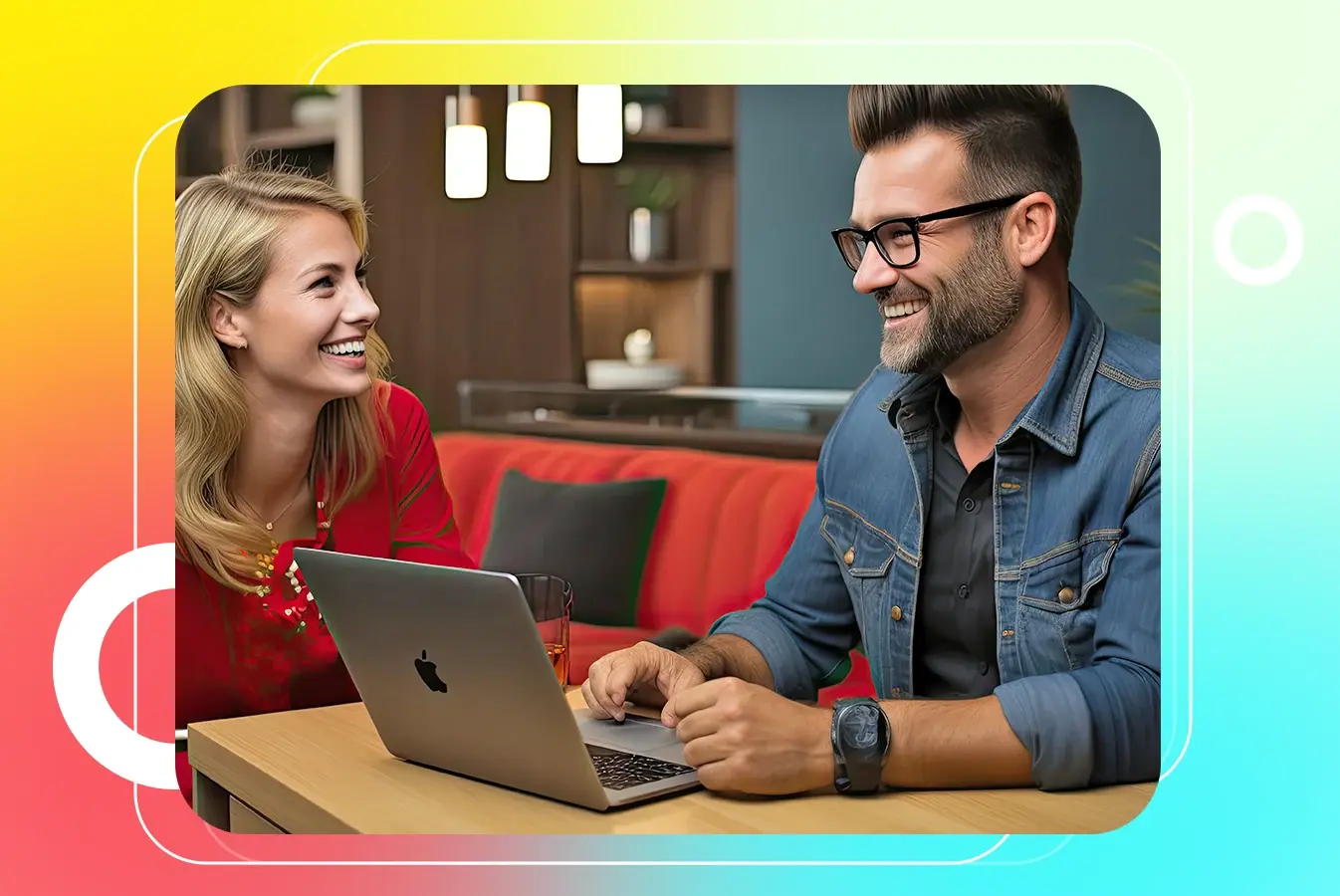 Two professionals working happily on a laptop