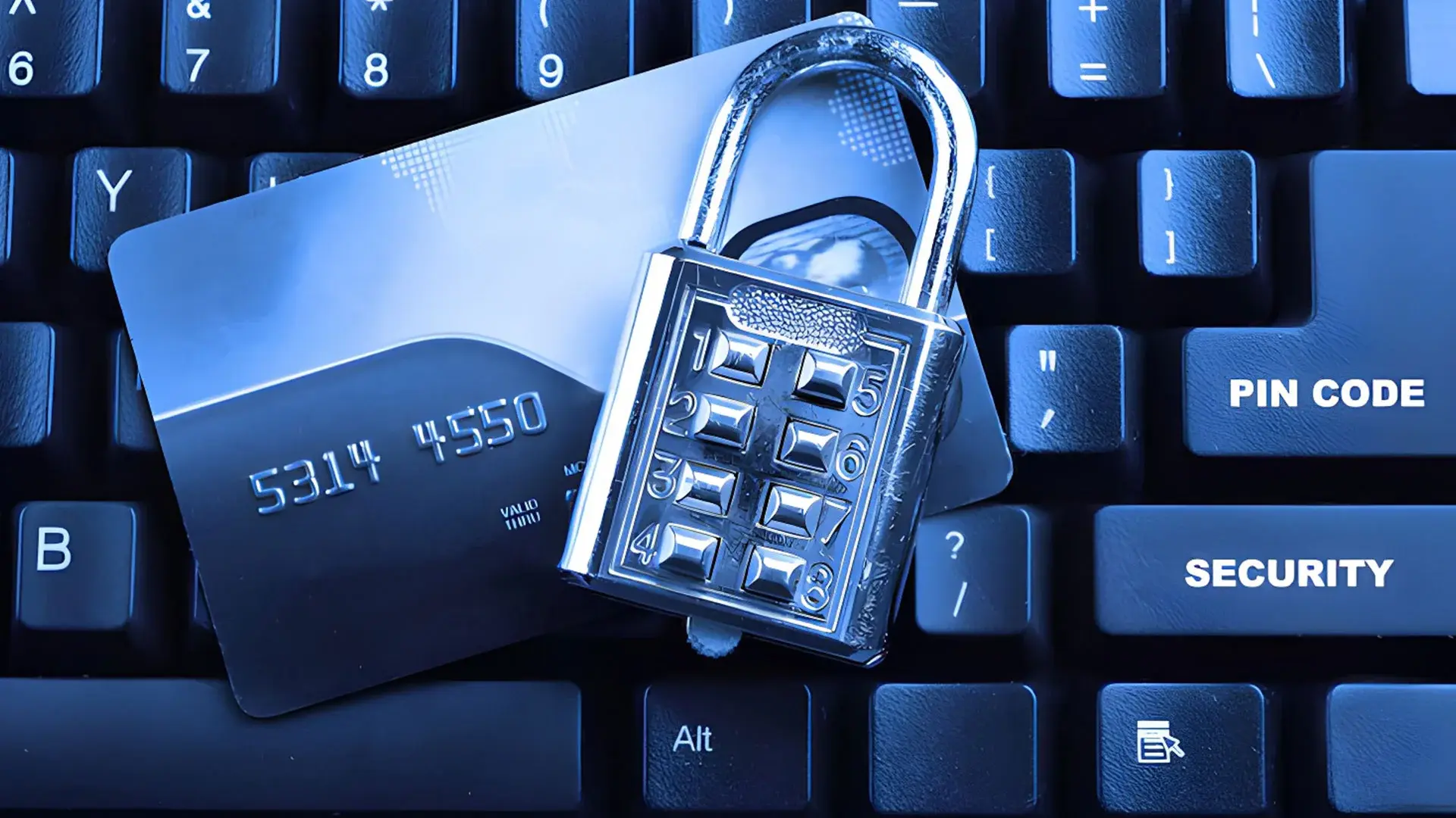 A numbered lock in front a keyboard and credit card, depicting how redaction tools are needed in banking