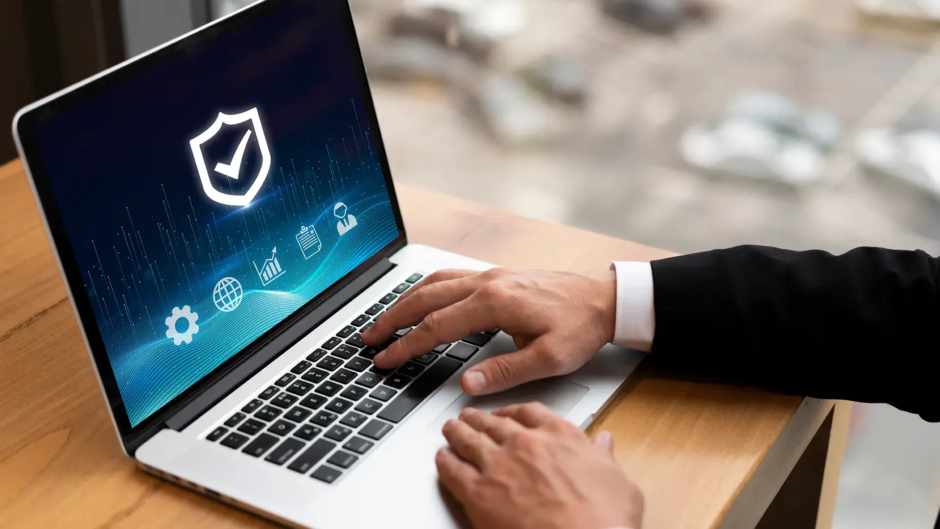 give short img alt text5:12 PMClaude responded: Hands typing on a laptop displaying a security shield icon with compliance and analytics symbols, representing sovereign AI and on-premise data protection.Hands typing on a laptop displaying a security shield icon with compliance and analytics symbols, representing sovereign AI and on-premise data protection.