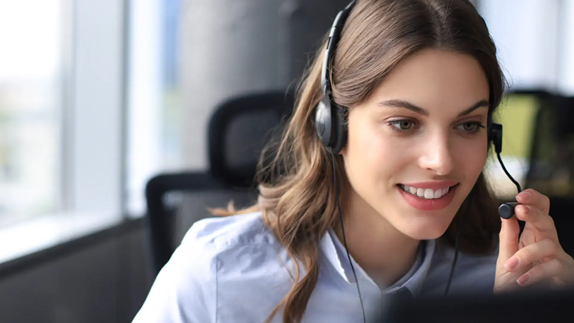 A call center operator wearing a microphone.
