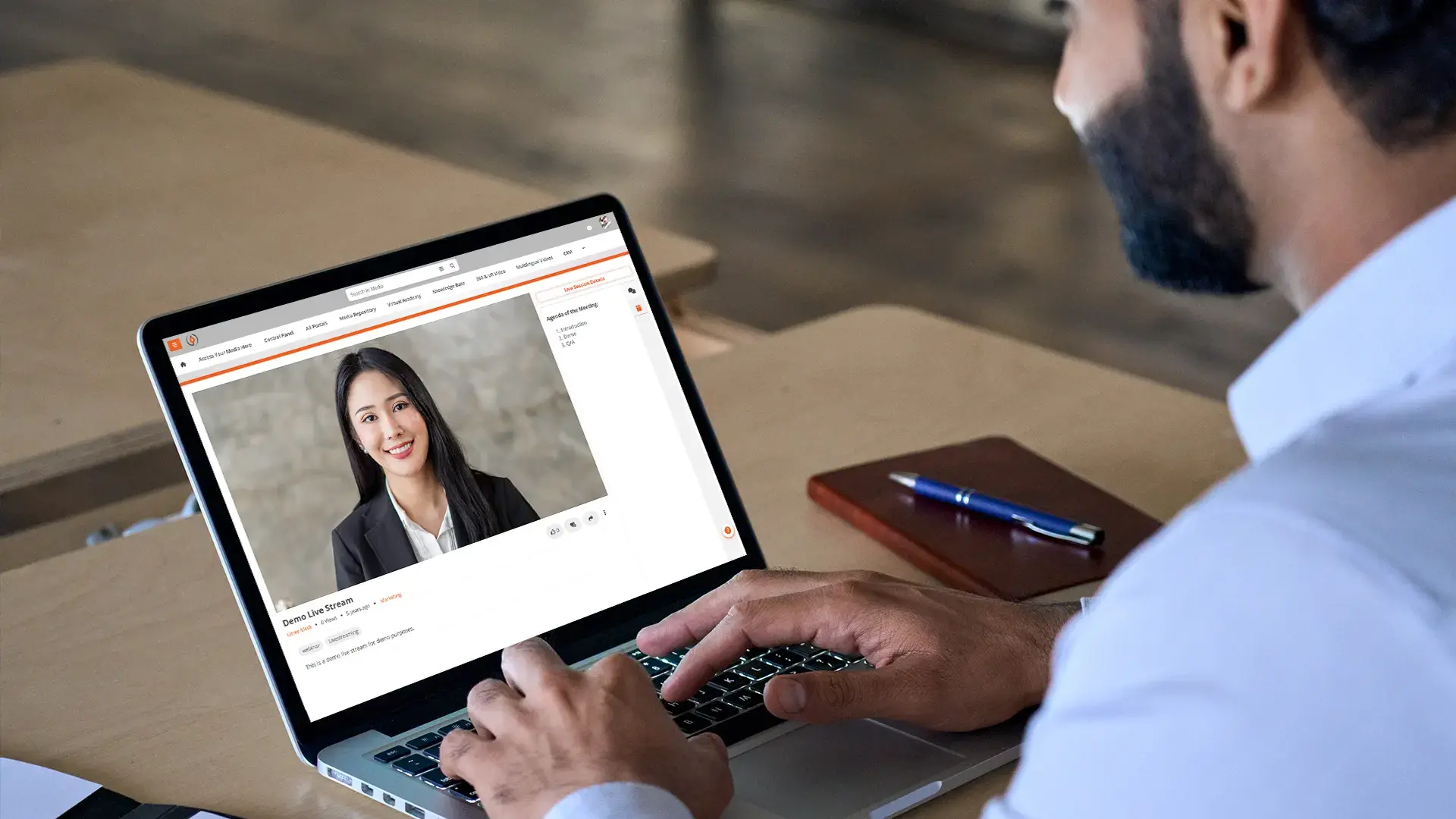 a person watching a video on a laptop on a video on demand platform