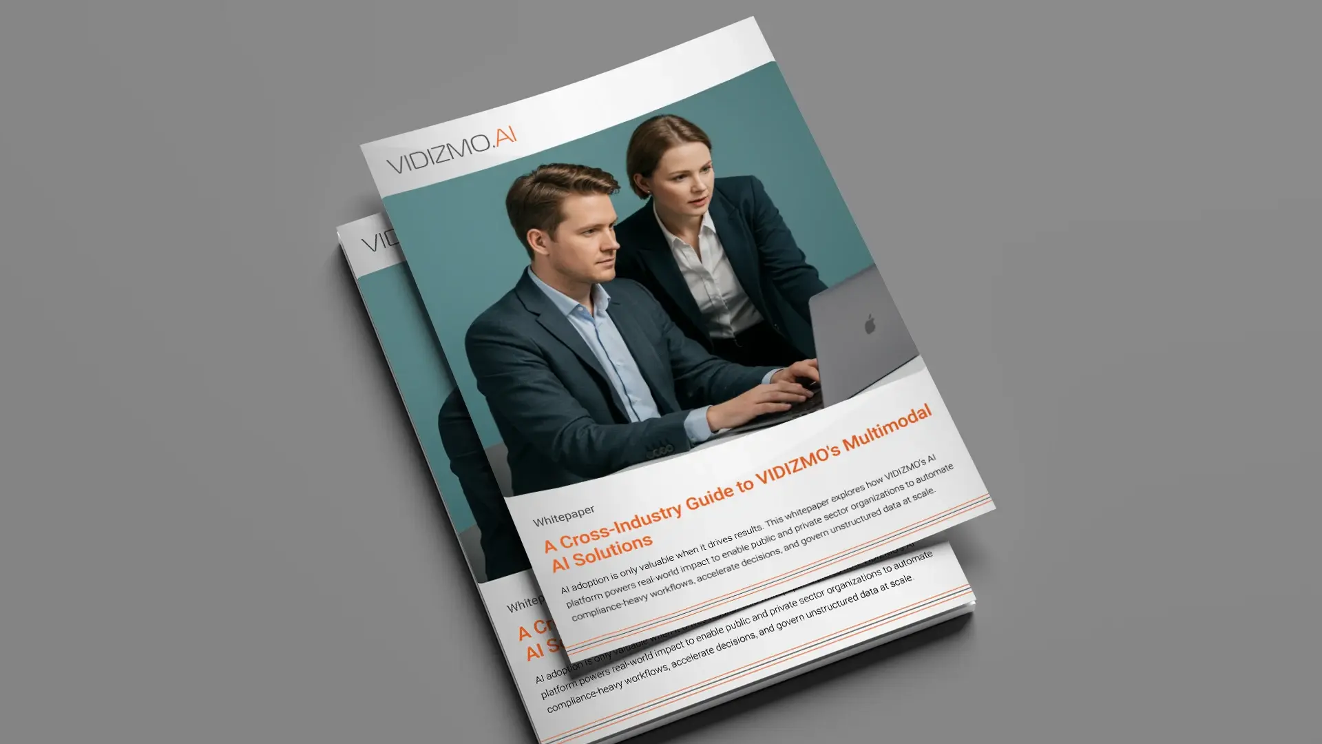 Two professionals review insights on a laptop screen representing VIDIZMO's enterprise-grade multimodal AI capabilities.