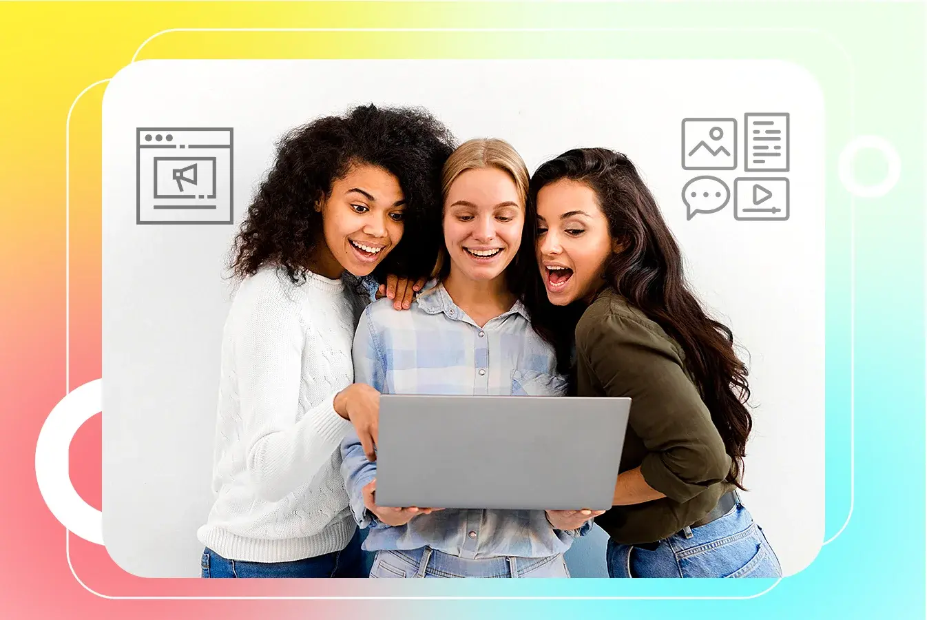 Three women looking at laptop together.