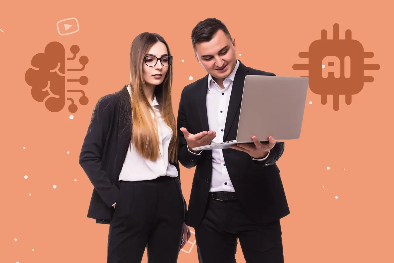 Two people working on a laptop.