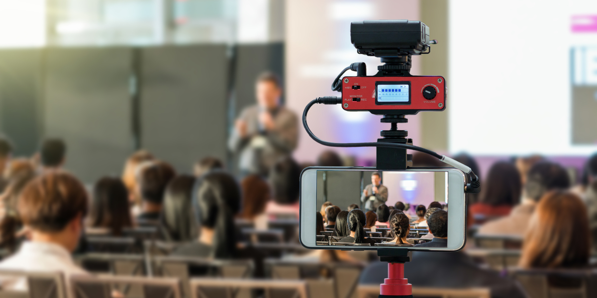 An image showing a corporate live streaming event being conducted