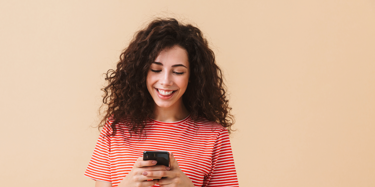 A woman sharing a video through her phone