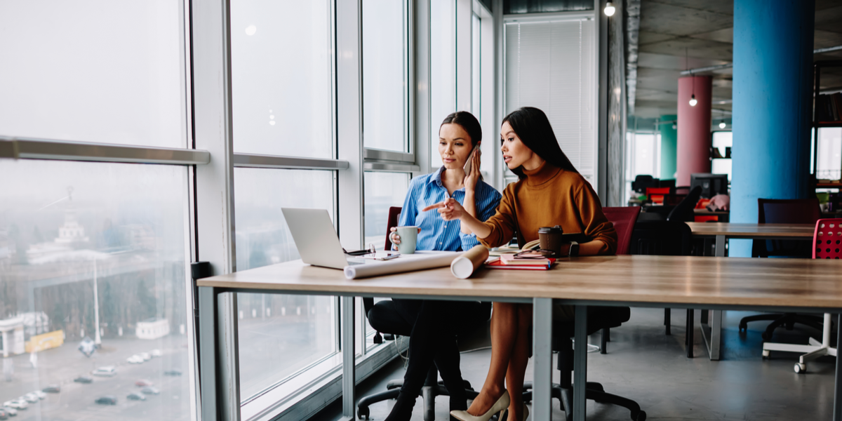 An image of two persons using a digital asset management system