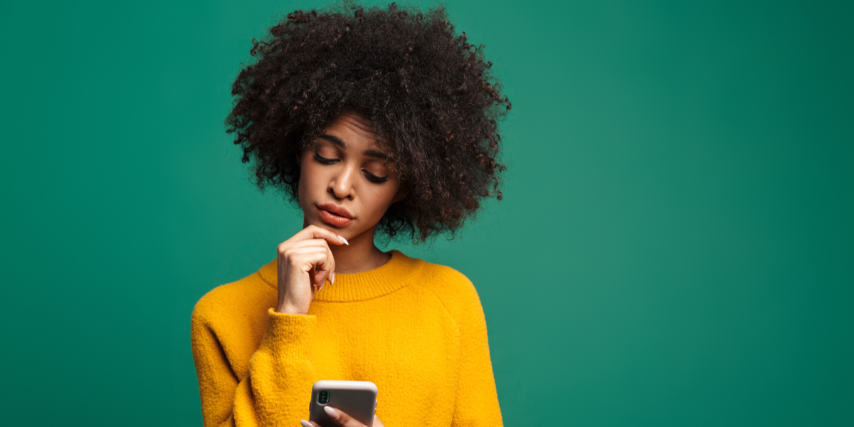 A woman browsing a website on her phone