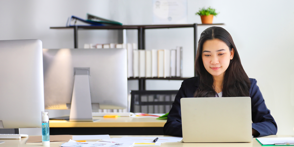 A sales person watching video on laptop