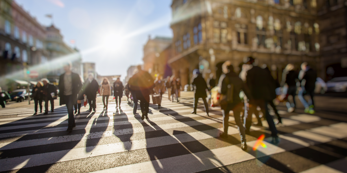 A surveillance footage of people walking on the street