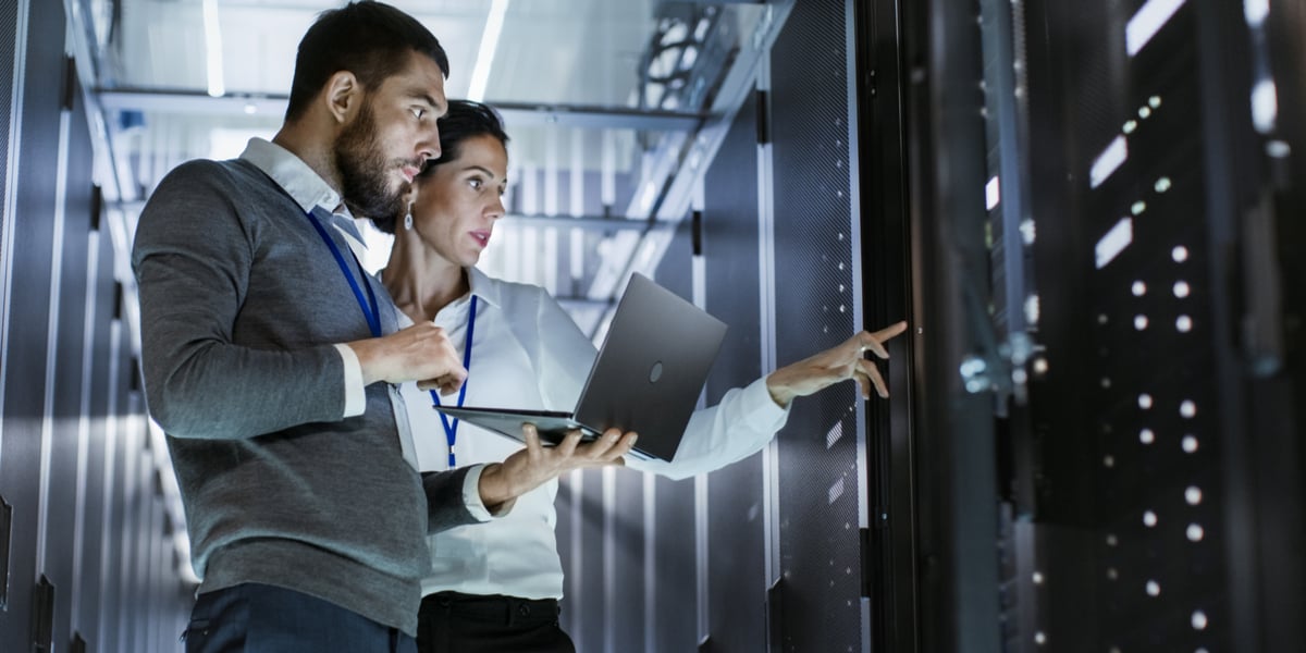 A woman and a man in a cloud data center for video services