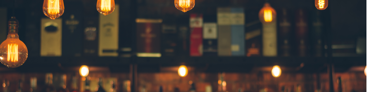 A bar where bottles can be seen